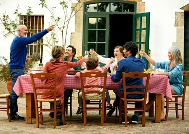 Multigenerational family toasting to grandfather